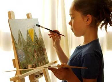 Girl painting easel